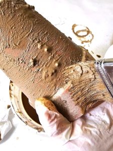 adding-lime-to-pot-with-a-brush