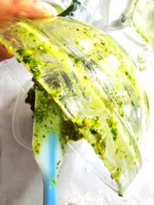 me-adding-pesto-to-plastic-container